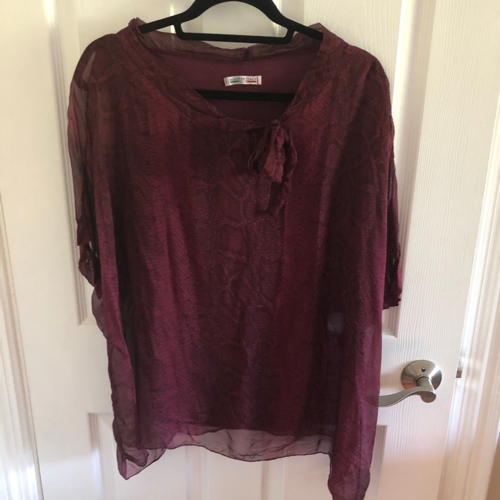 Burgundy knit tank with sheer overlay.